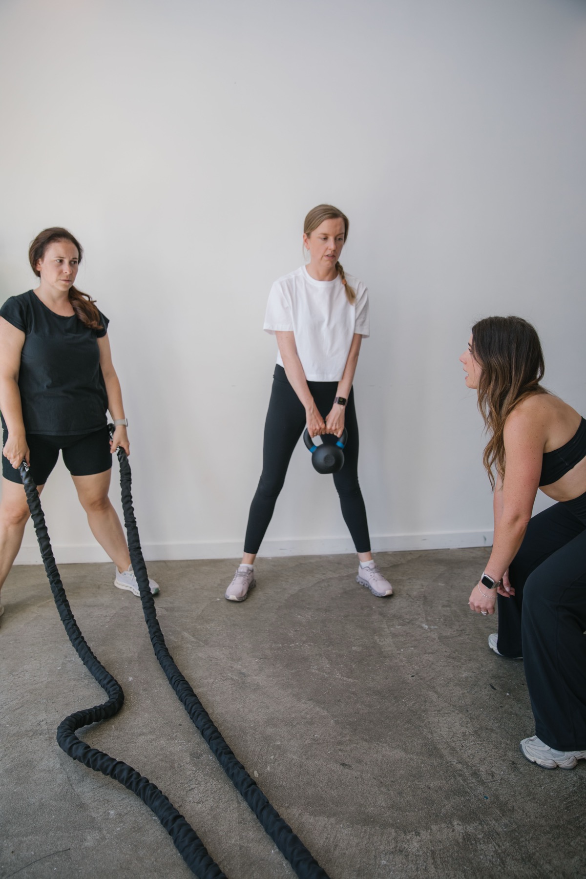 Alex coaching a client through a strength training session